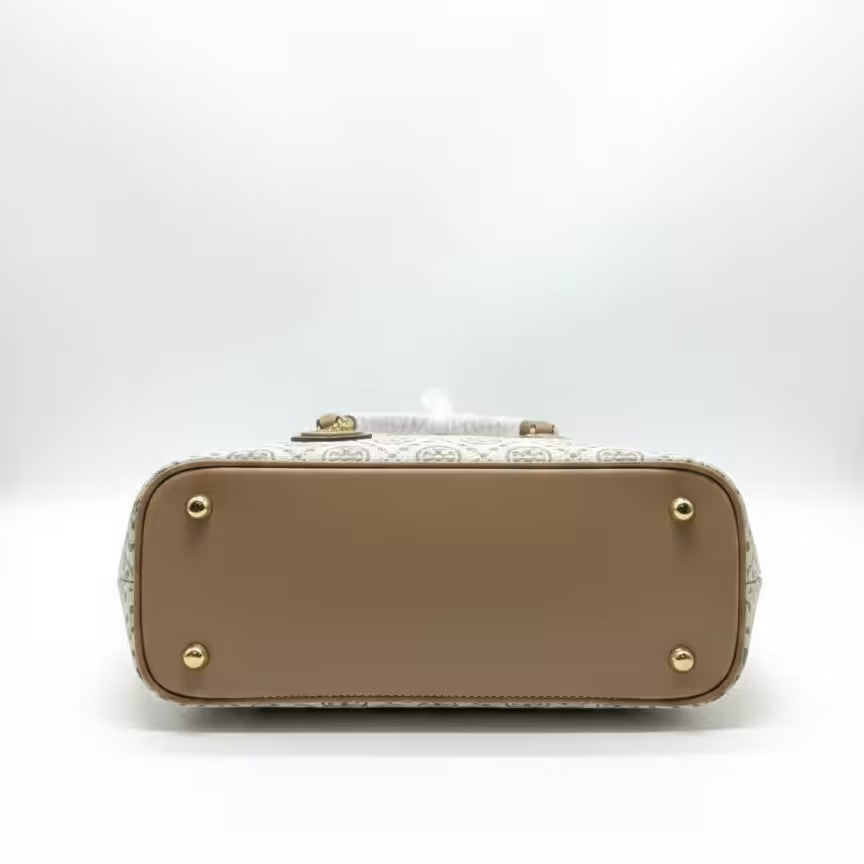 The T Burch Jacquard Swing Satchel.