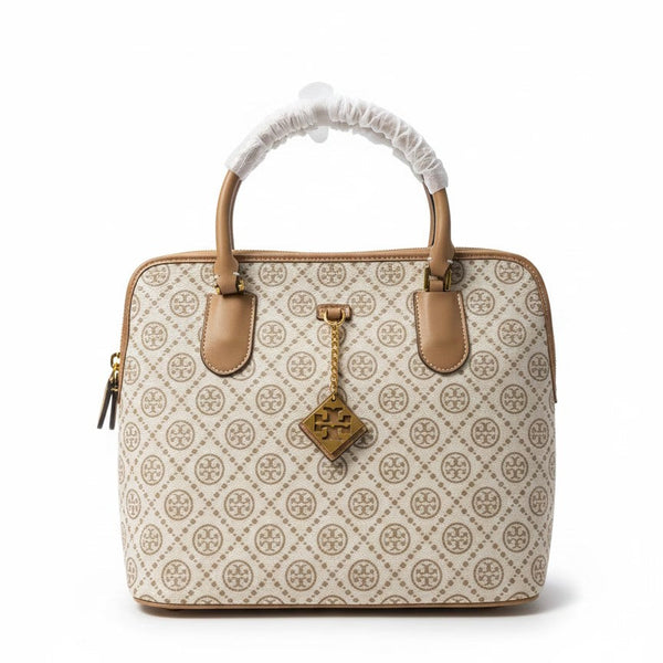 The T Burch Jacquard Swing Satchel.