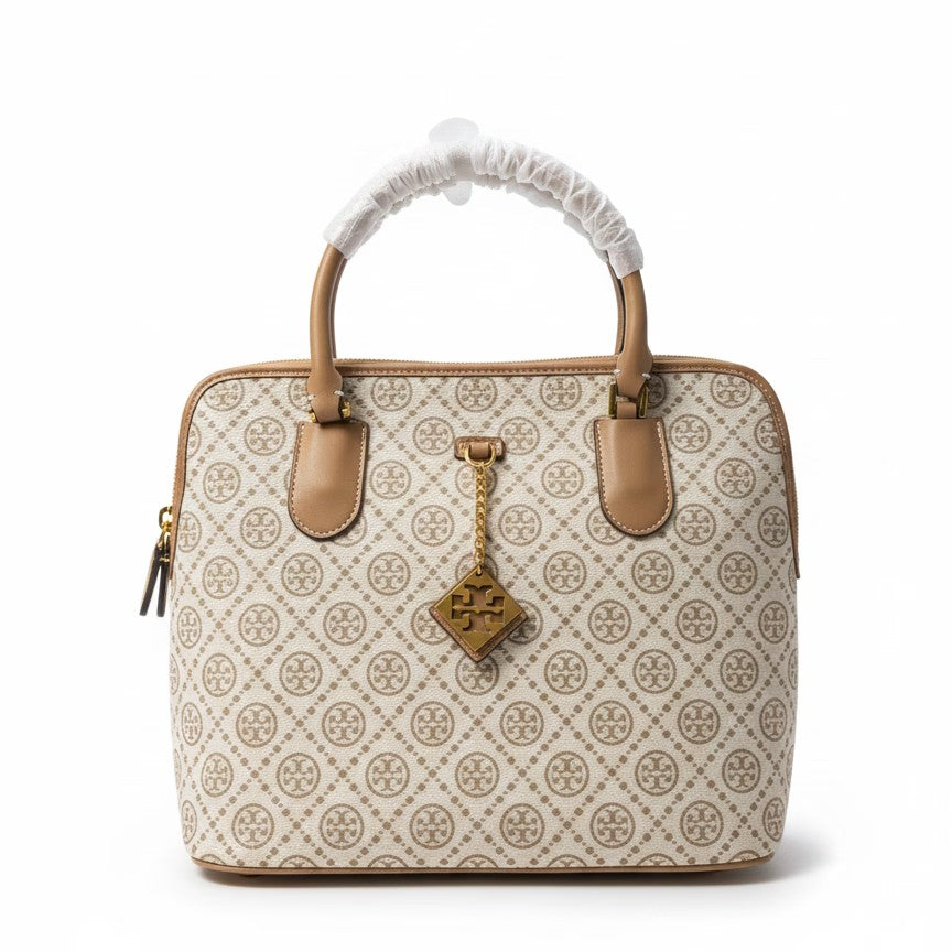 The T Burch Jacquard Swing Satchel.