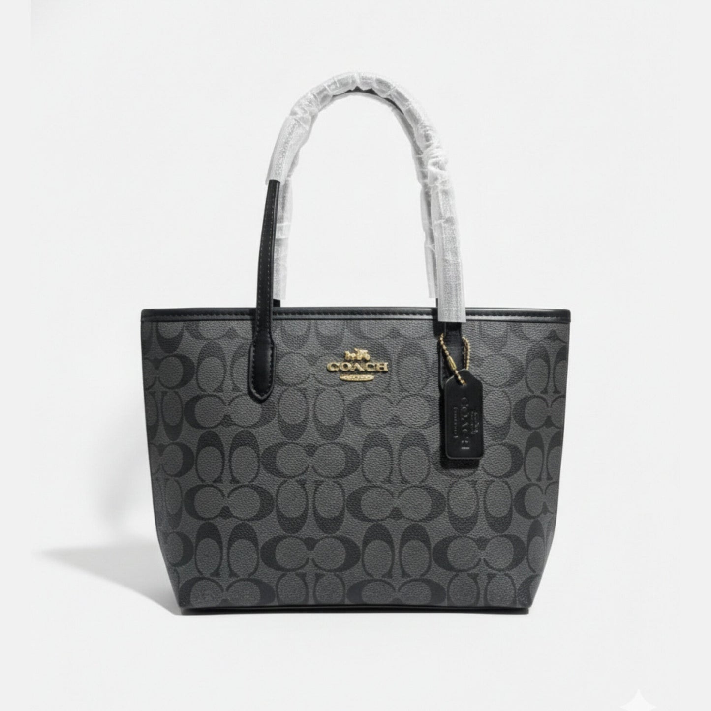 The Mini City Tote bag in signature canvas